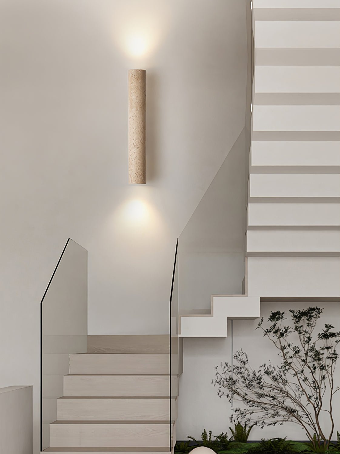 A glass-railed staircase with greenery below sits beneath this Clérachic wall light, lit.