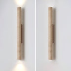 Two studio views of this Clérachic wall light sit side by side against a plain wall.