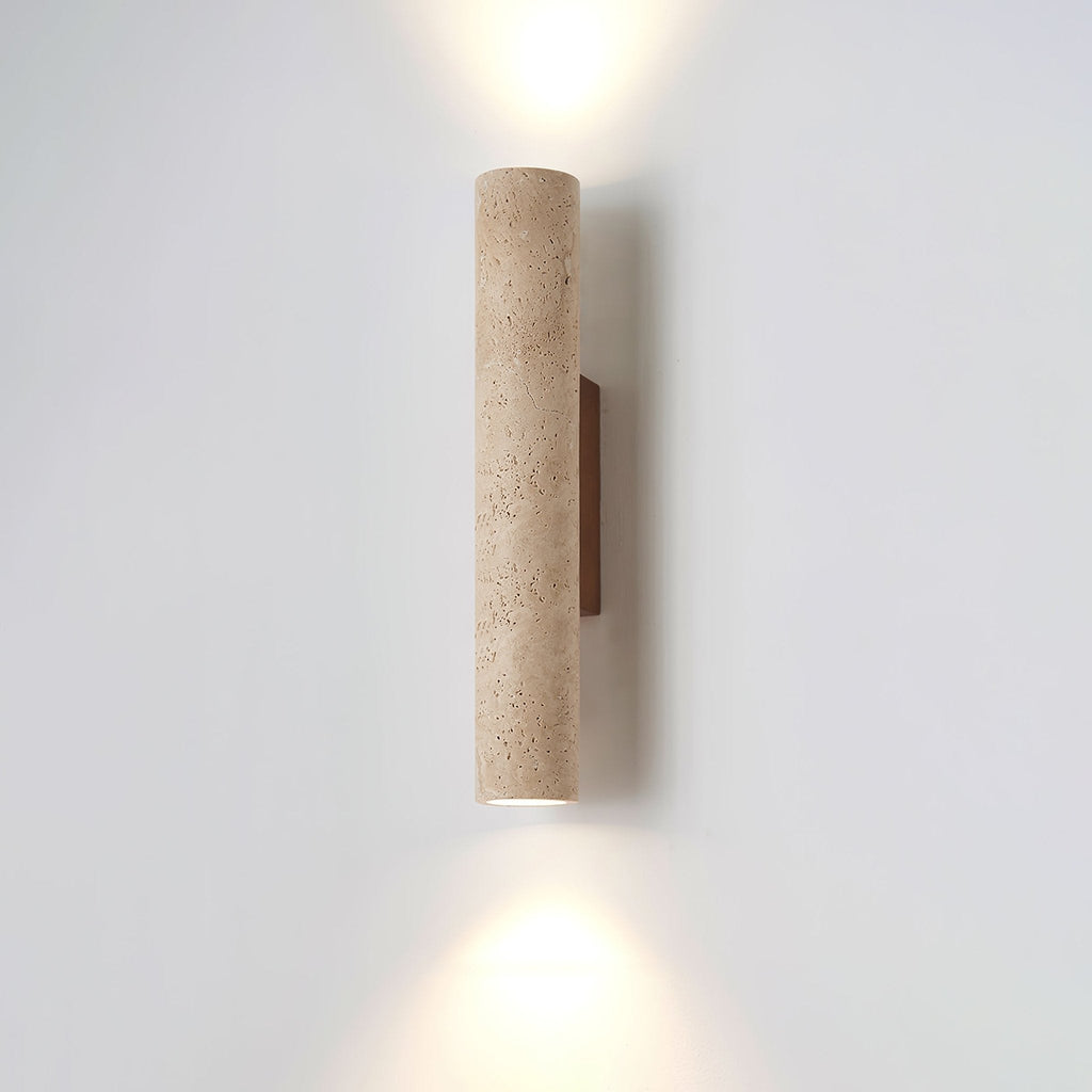 Straight-on studio shot of this Clérachic wall light, lit, against a plain grey backdrop.