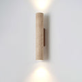 Straight-on studio shot of this Clérachic wall light, lit, against a plain grey backdrop.