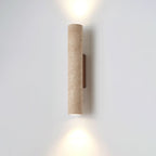 Straight-on studio shot of this Clérachic wall light, lit, against a plain grey backdrop.