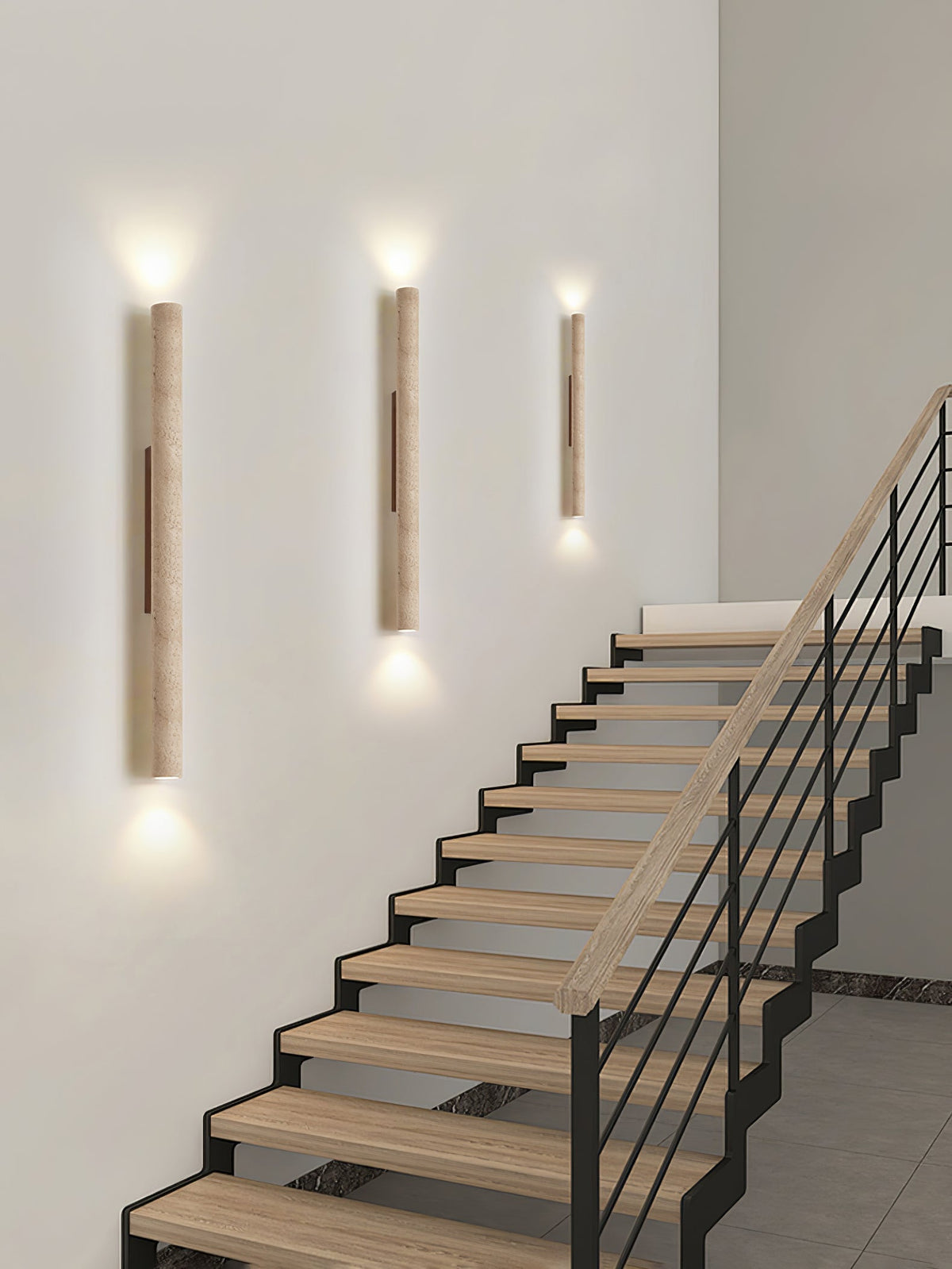 Ascending a staircase wall beside an iron handrail, three of this Clérachic wall light glow lit.
