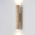 Angled studio shot of this Clérachic wall light, lit, walnut wood mount showing at the side.