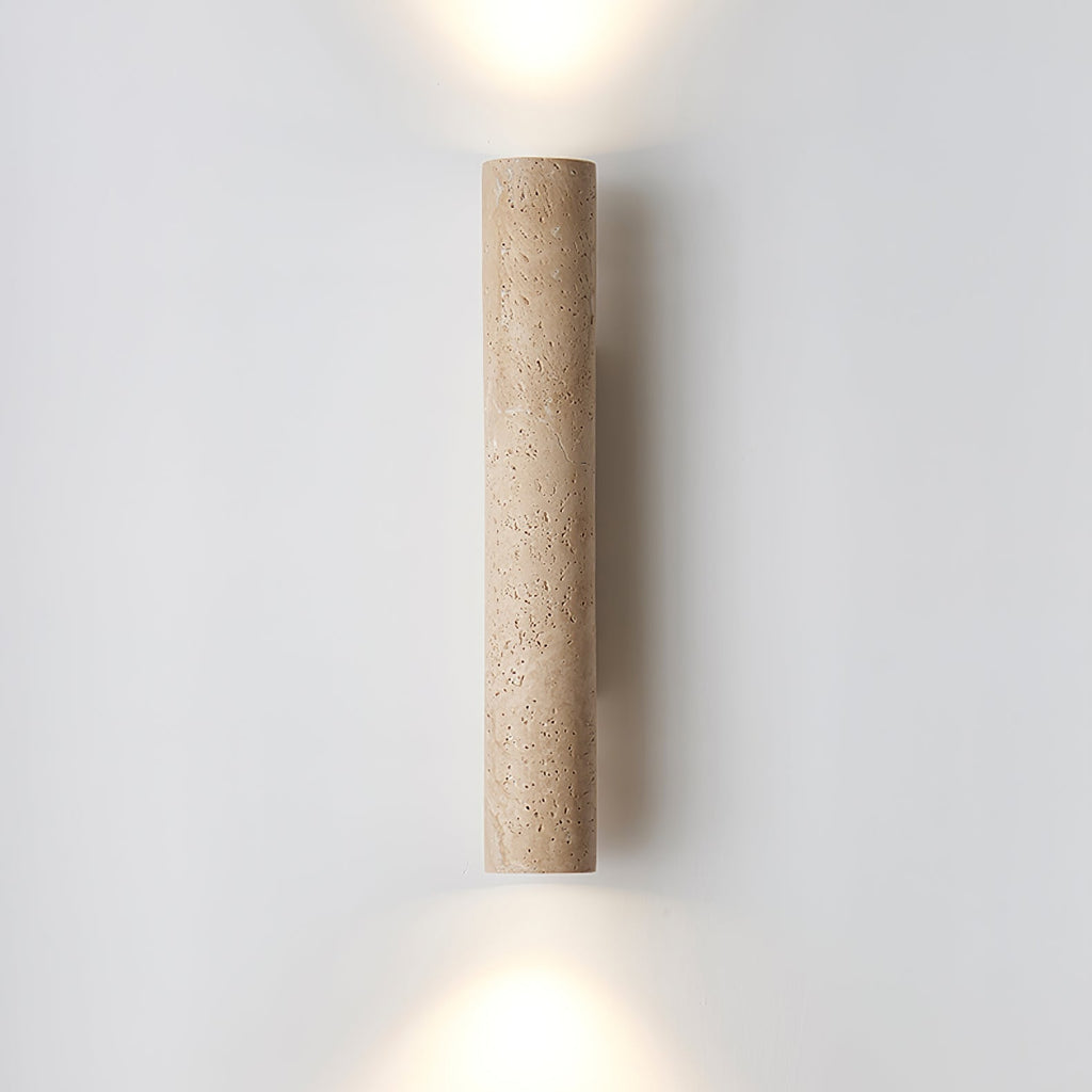 Set against a plain grey backdrop, the taller version of this Clérachic wall light glows lit.