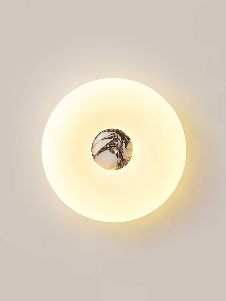 Clérachic ceiling light in a tall crop, its stone centre showing deep purple-grey veining lit from within.