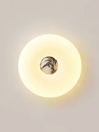 Clérachic ceiling light in a tall crop, its stone centre showing deep purple-grey veining lit from within.