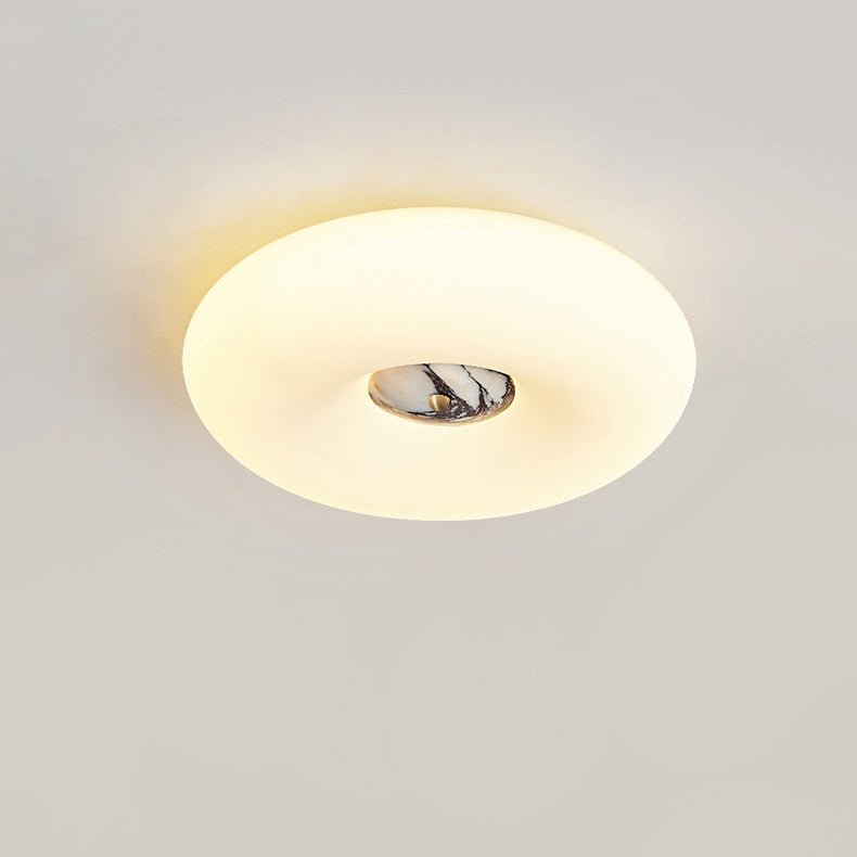 Clérachic ceiling light lit in a wider crop above a wood-slat headboard, full window and curtain in view.