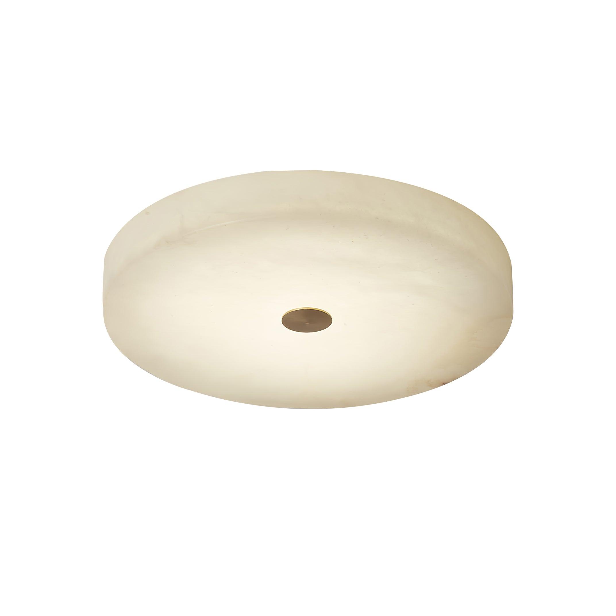Product view of the unlit Olaean flush mount on white, showing the cream alabaster drum and brass cap.