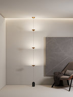 Floor lamp with gold conical shades and matte black marble base