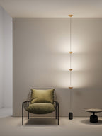 Floor lamp with gold shades and black marble counterweight base