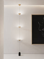 Floor lamp shown beside furniture in a warm-lit living room