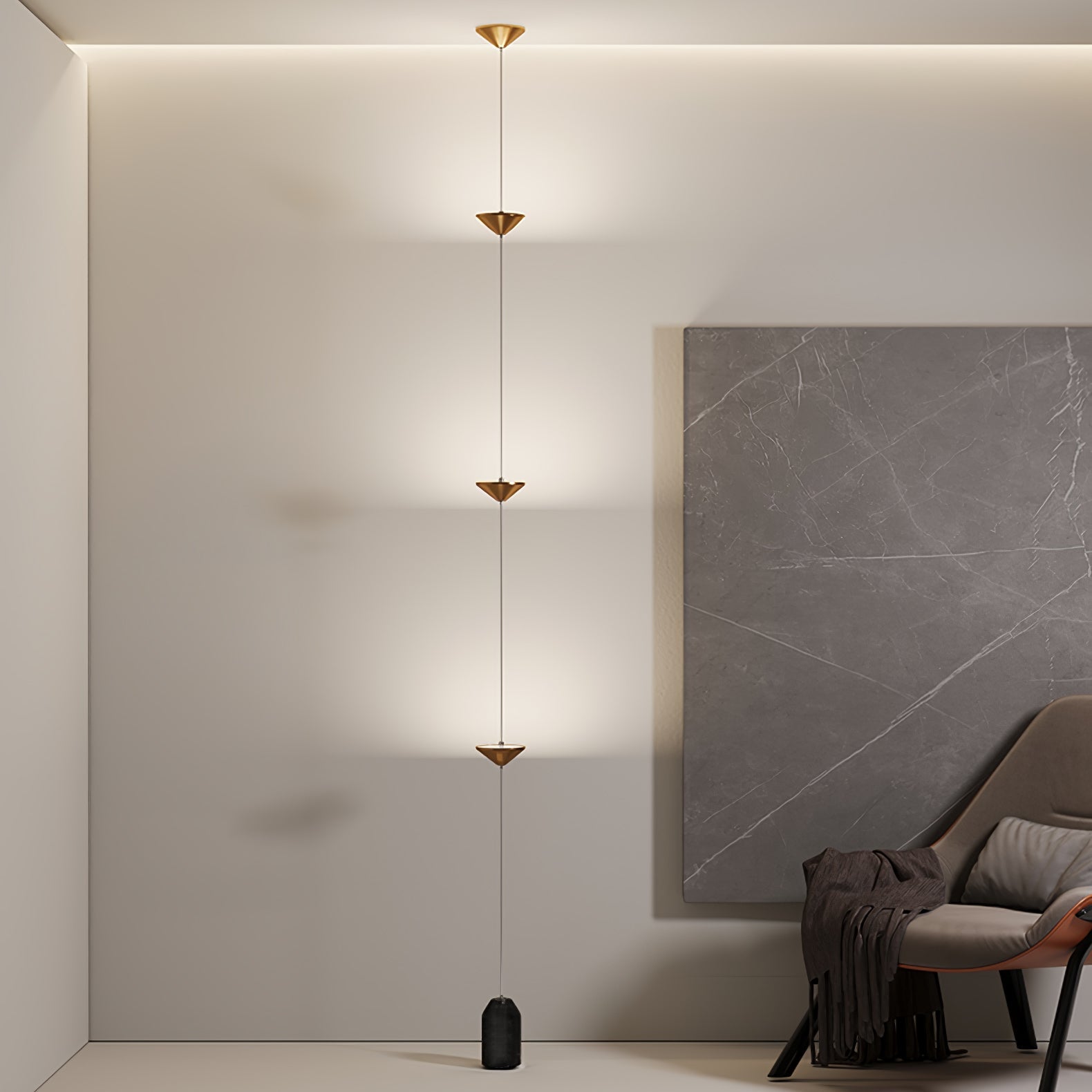 Floor lamp with gold shades beside seating in an interior