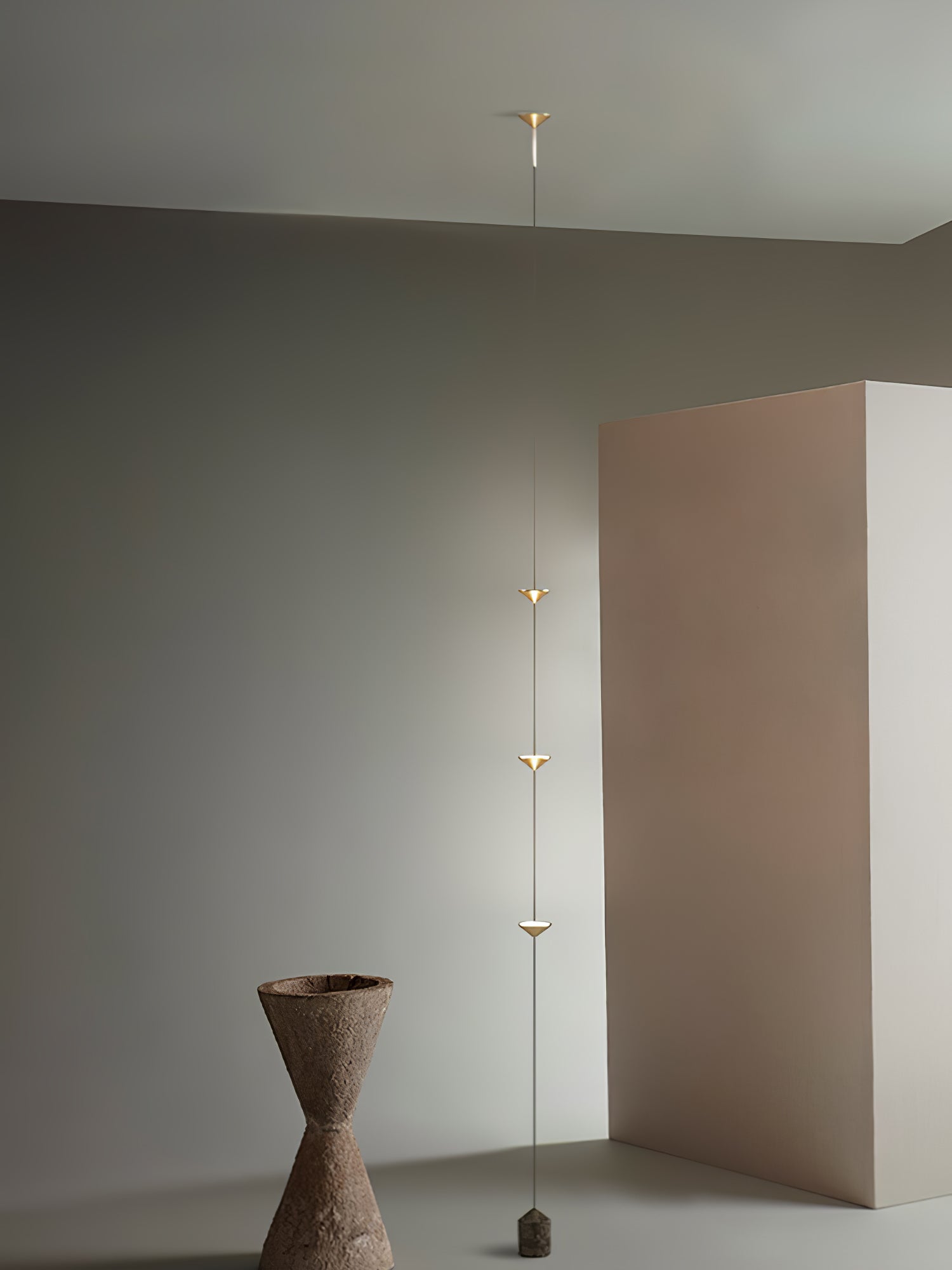 Floor lamp viewed full height against a neutral wall