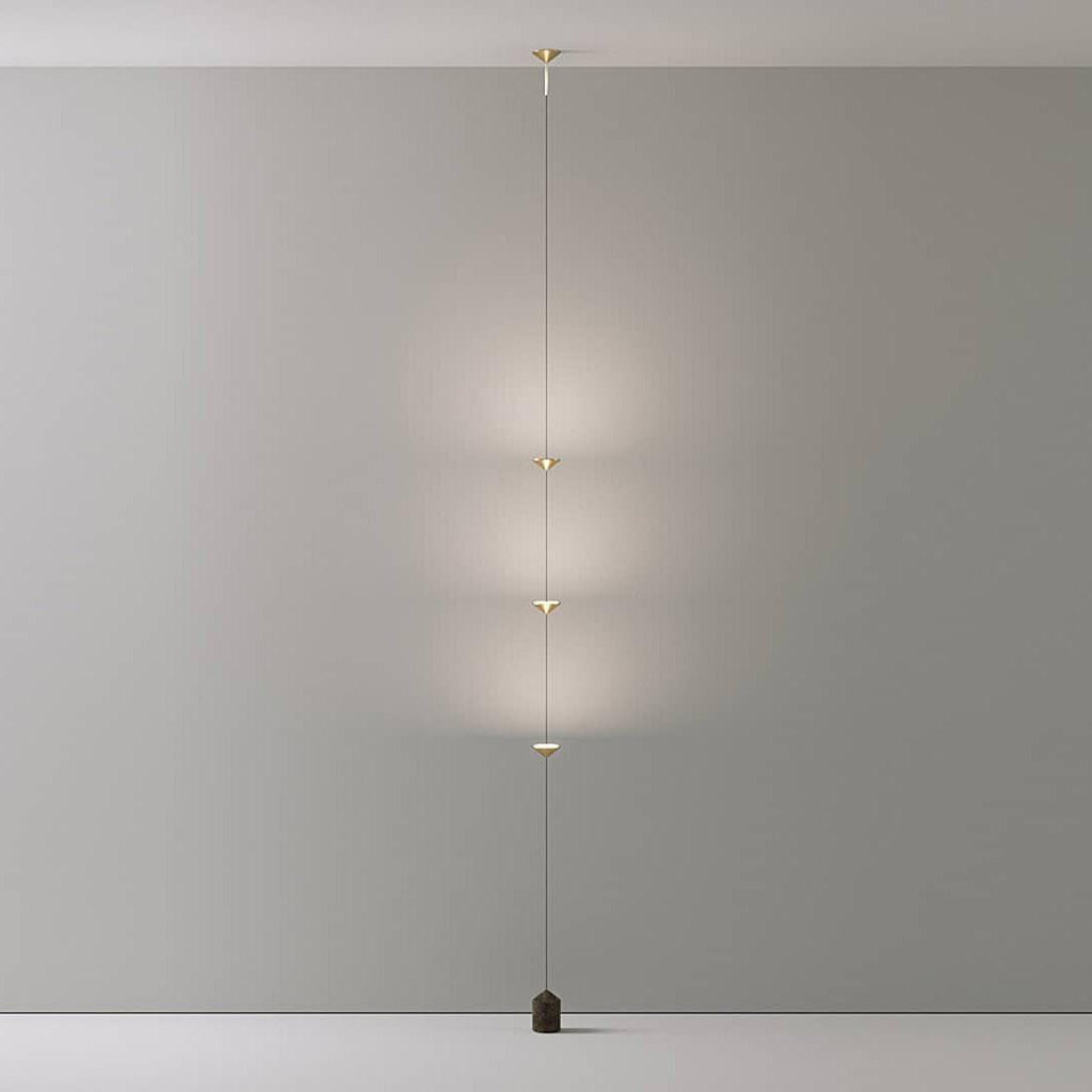 Floor lamp with gold conical shades and black marble base