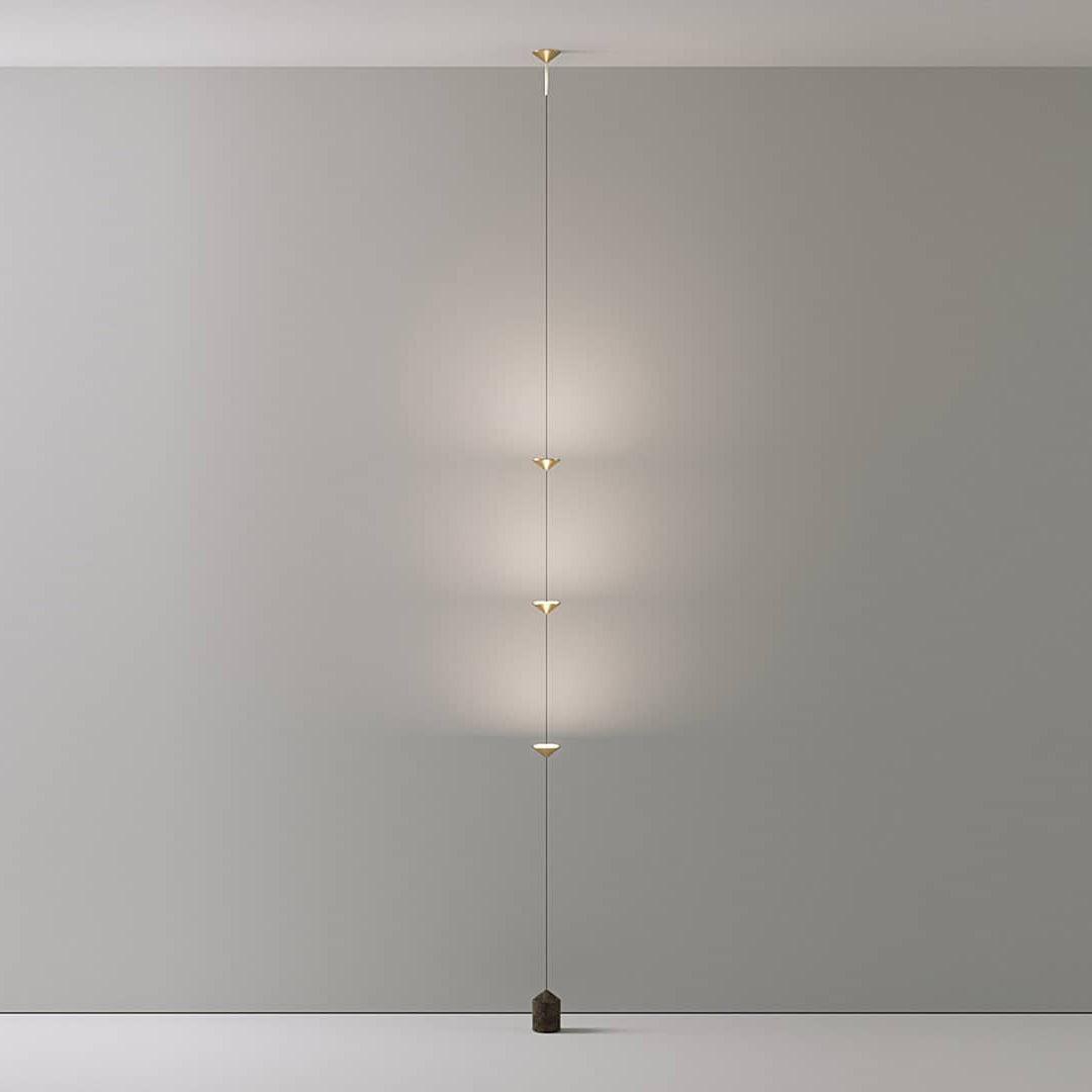 Floor lamp with gold conical shades and black marble base