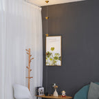 Floor lamp with conical gold shades in a styled setting