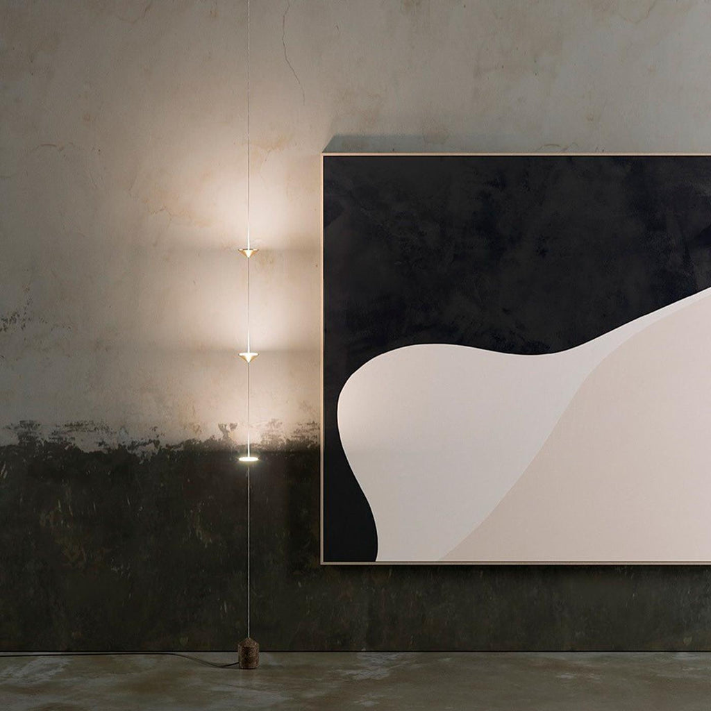 Floor lamp casting warm light in a contemporary living space