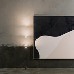 Floor lamp casting warm light in a contemporary living space