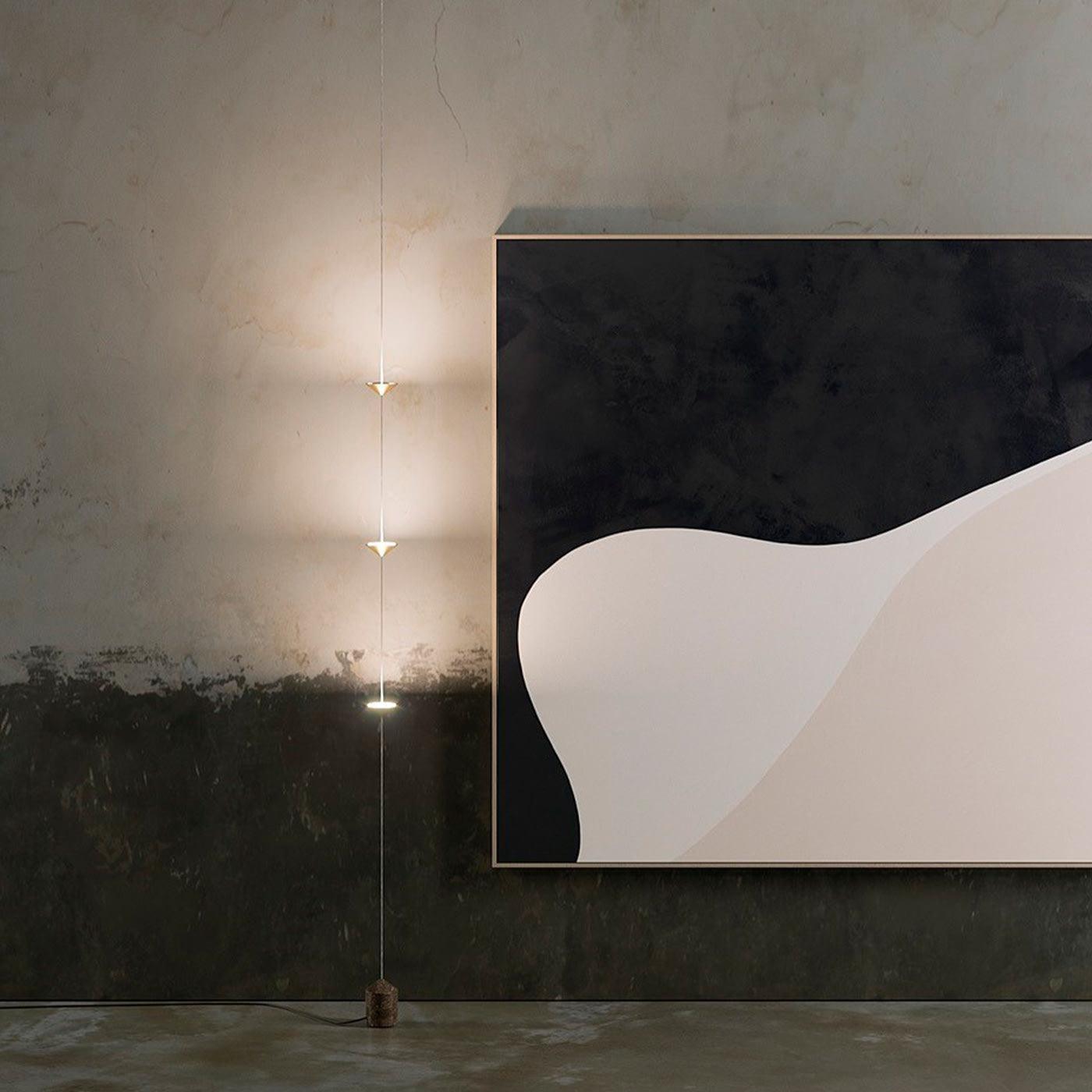 Floor lamp casting warm light in a contemporary living space