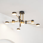 Spider chandelier with gold and black contrast in a styled interior