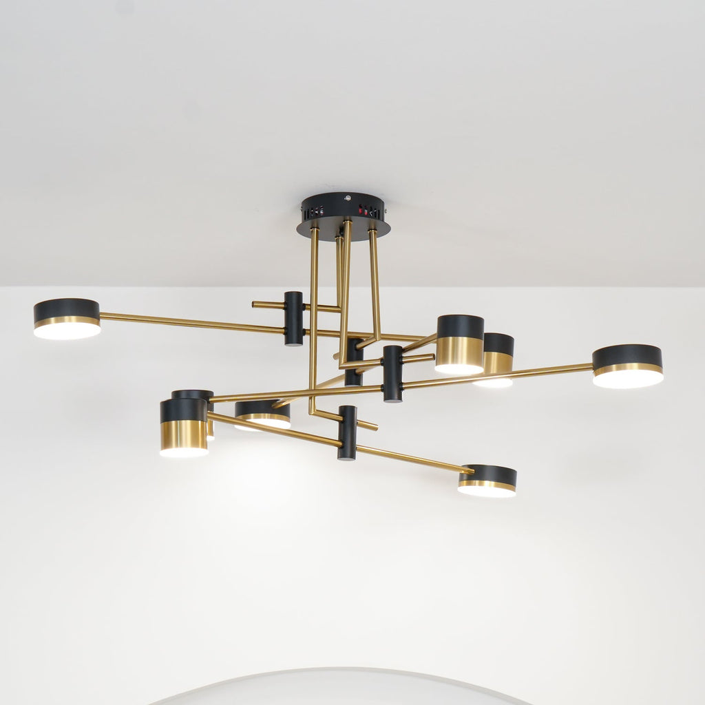 Spider chandelier sculptural form against a pale ceiling