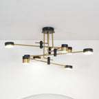 Spider chandelier sculptural form against a pale ceiling