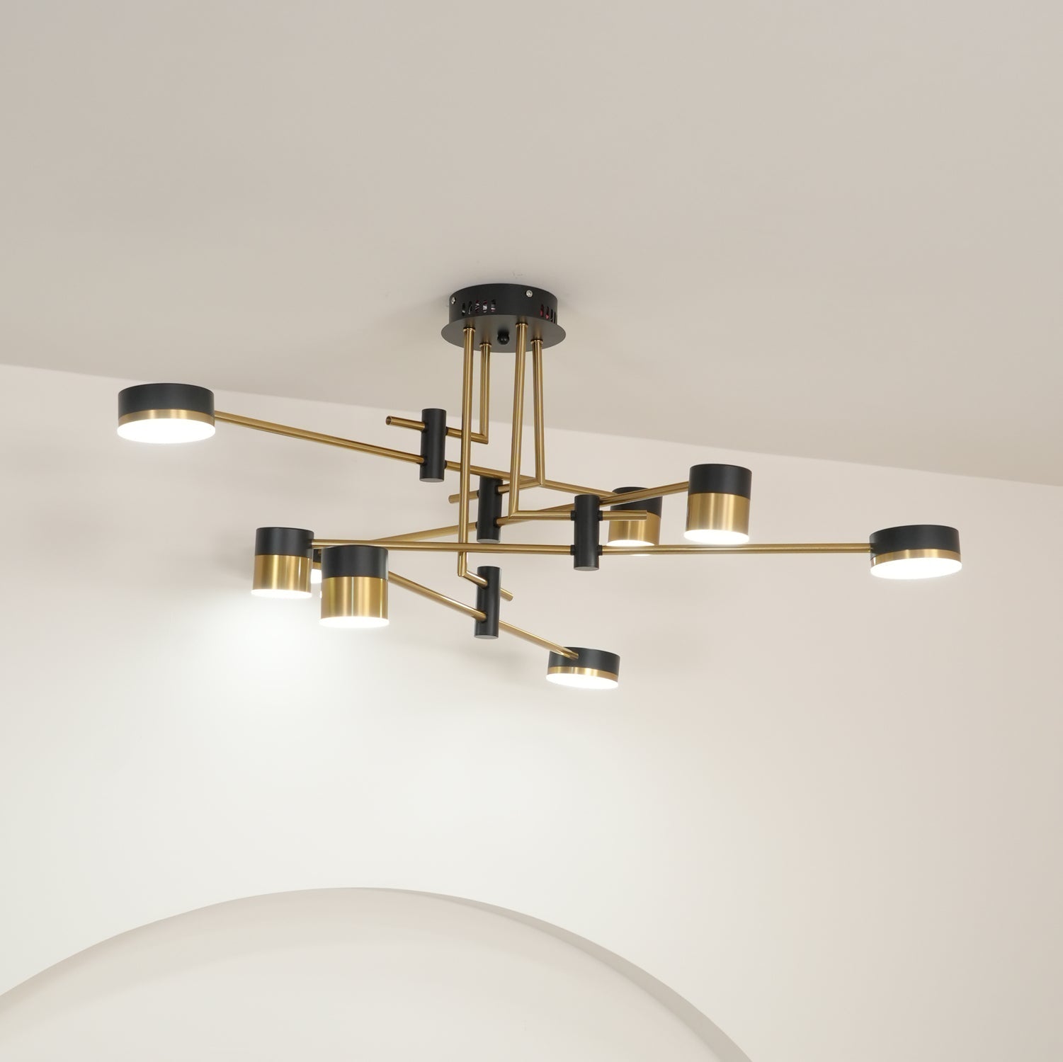 Spider chandelier glowing softly with warm light in a room