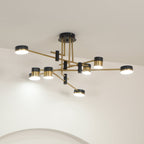 Spider chandelier casting warm light over a room below