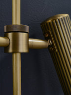 Detail of the swivel joint on this Clérachic plug-in spotlight in bronze finish, connecting head to rail.