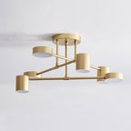 Sputnik ceiling light with six glowing white acrylic shades on splayed arms