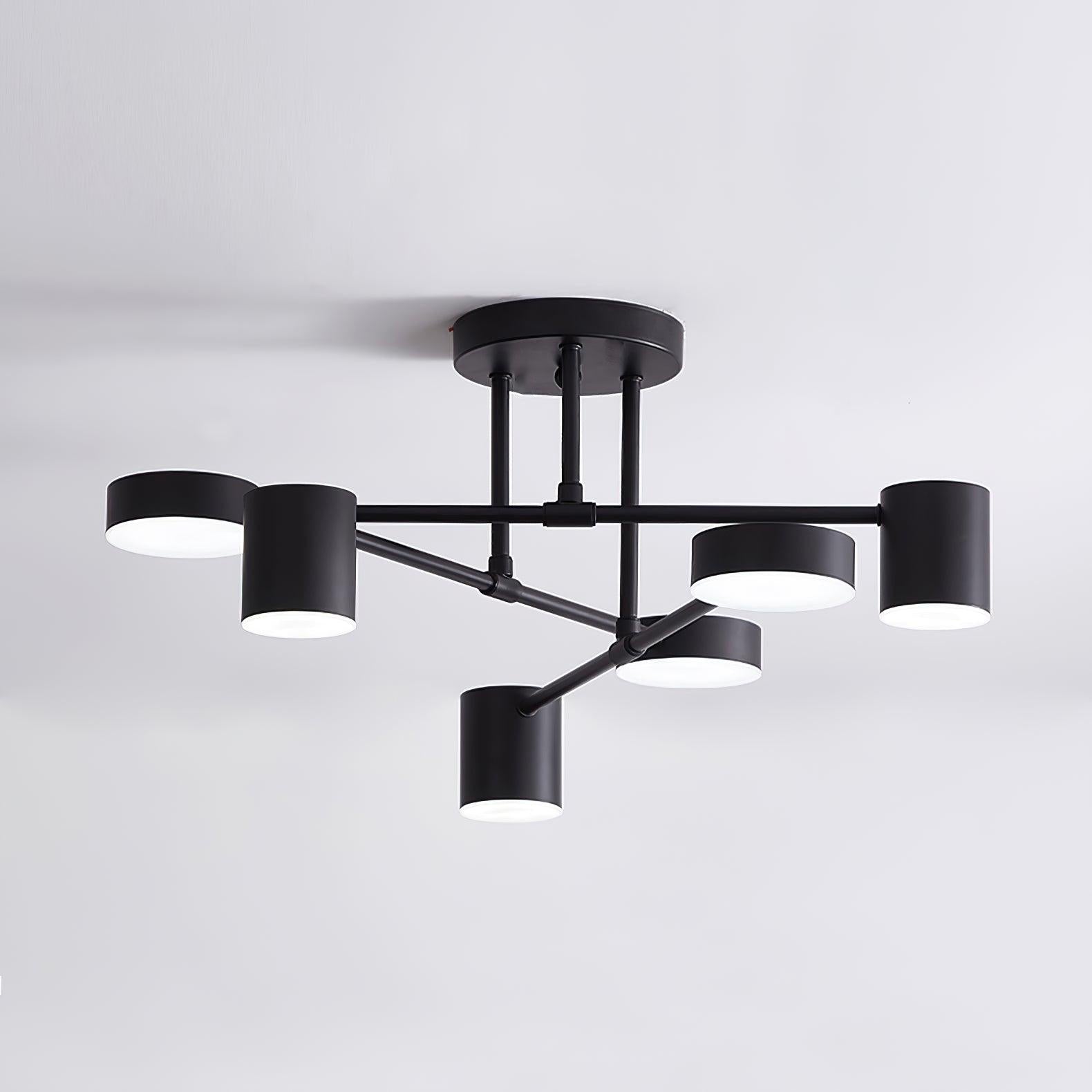 Multi-arm Sputnik ceiling light lit in a modern living room