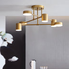 Sputnik ceiling light with white acrylic shades against a pale ceiling