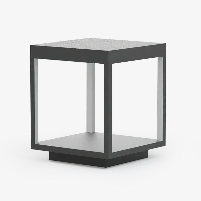 Square stainless steel outdoor light standing on a patio