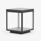Square stainless steel outdoor light standing on a patio