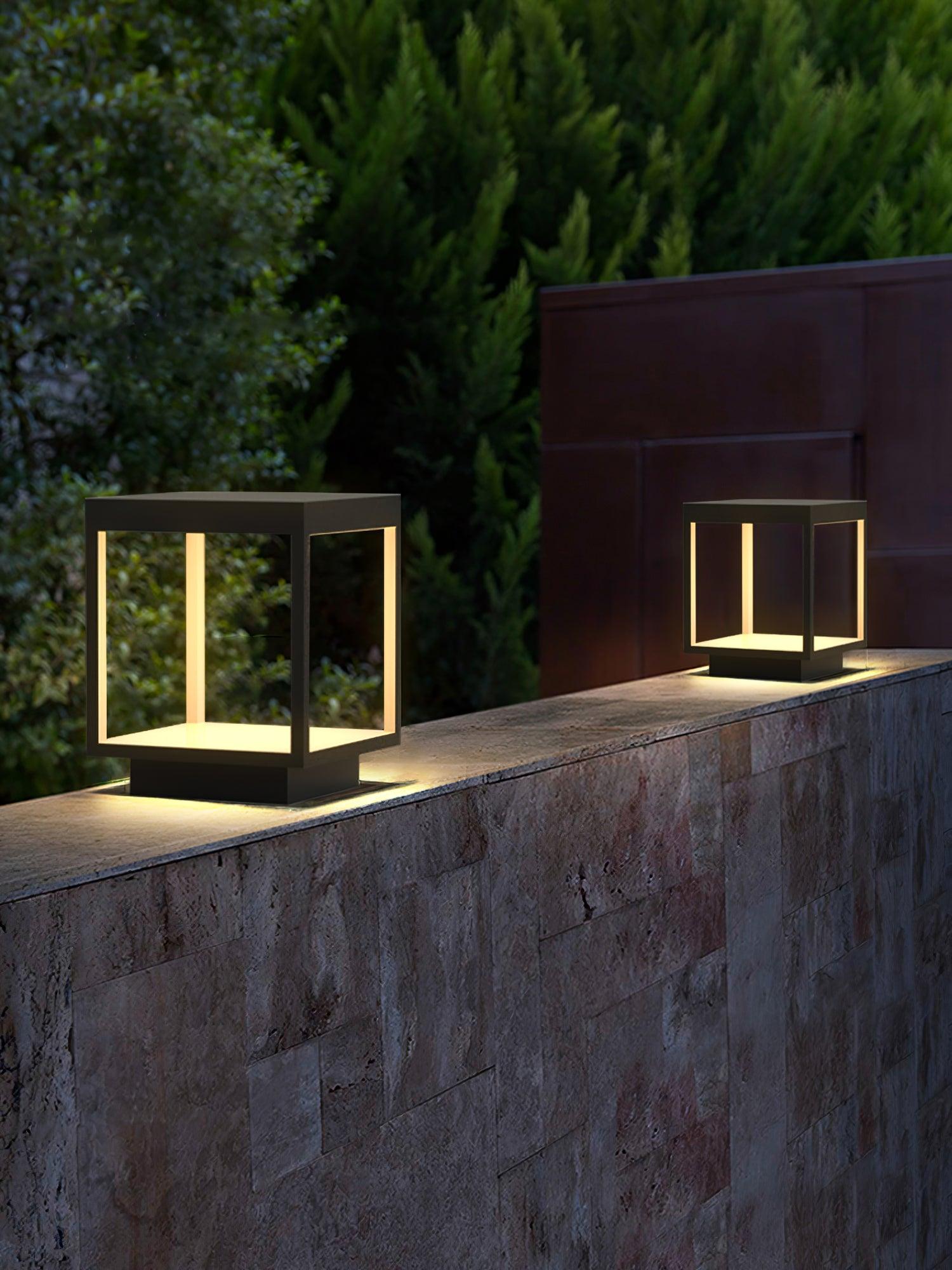 Outdoor post light lighting a pathway through a garden