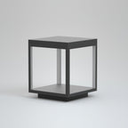Outdoor post light illuminating a walkway after dark