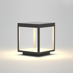 Square frame outdoor light shown lit against the evening