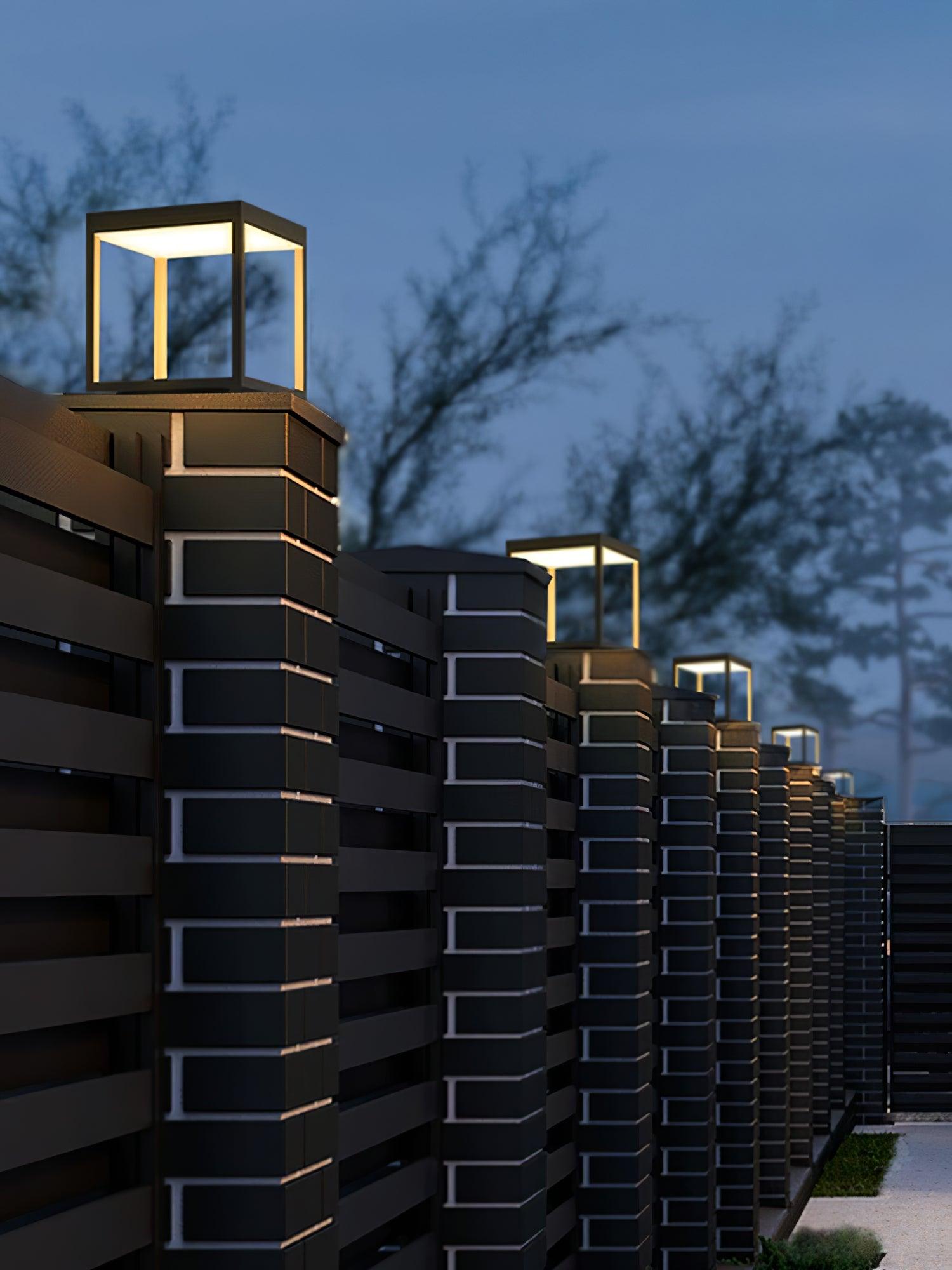 Square frame outdoor light mounted on a base plate outdoors