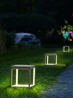 Outdoor post light lighting a patio corner in warm tones