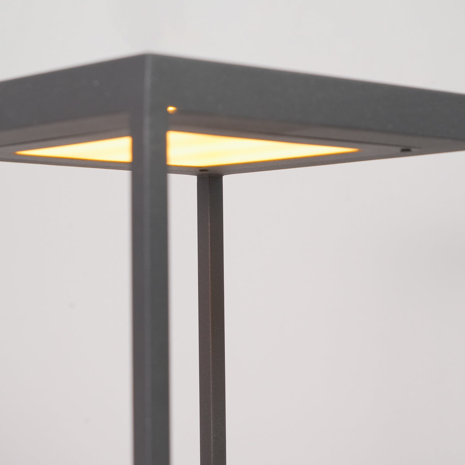 Outdoor post light with stainless steel frame on a base plate