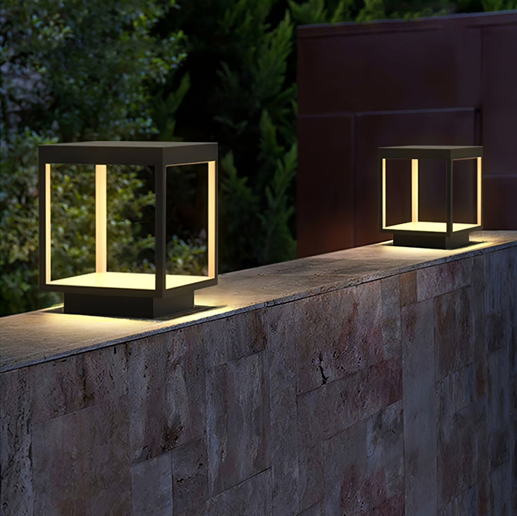 Square solar outdoor light lighting a pathway at dusk