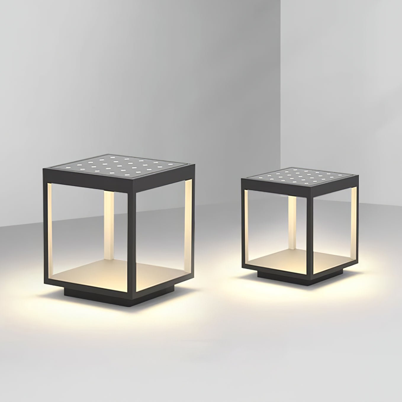 Square frame solar outdoor light glowing along a path