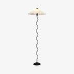 Squiggle floor lamp standing in a bright corner setting