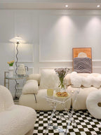 Squiggle floor lamp positioned in a minimalist living room