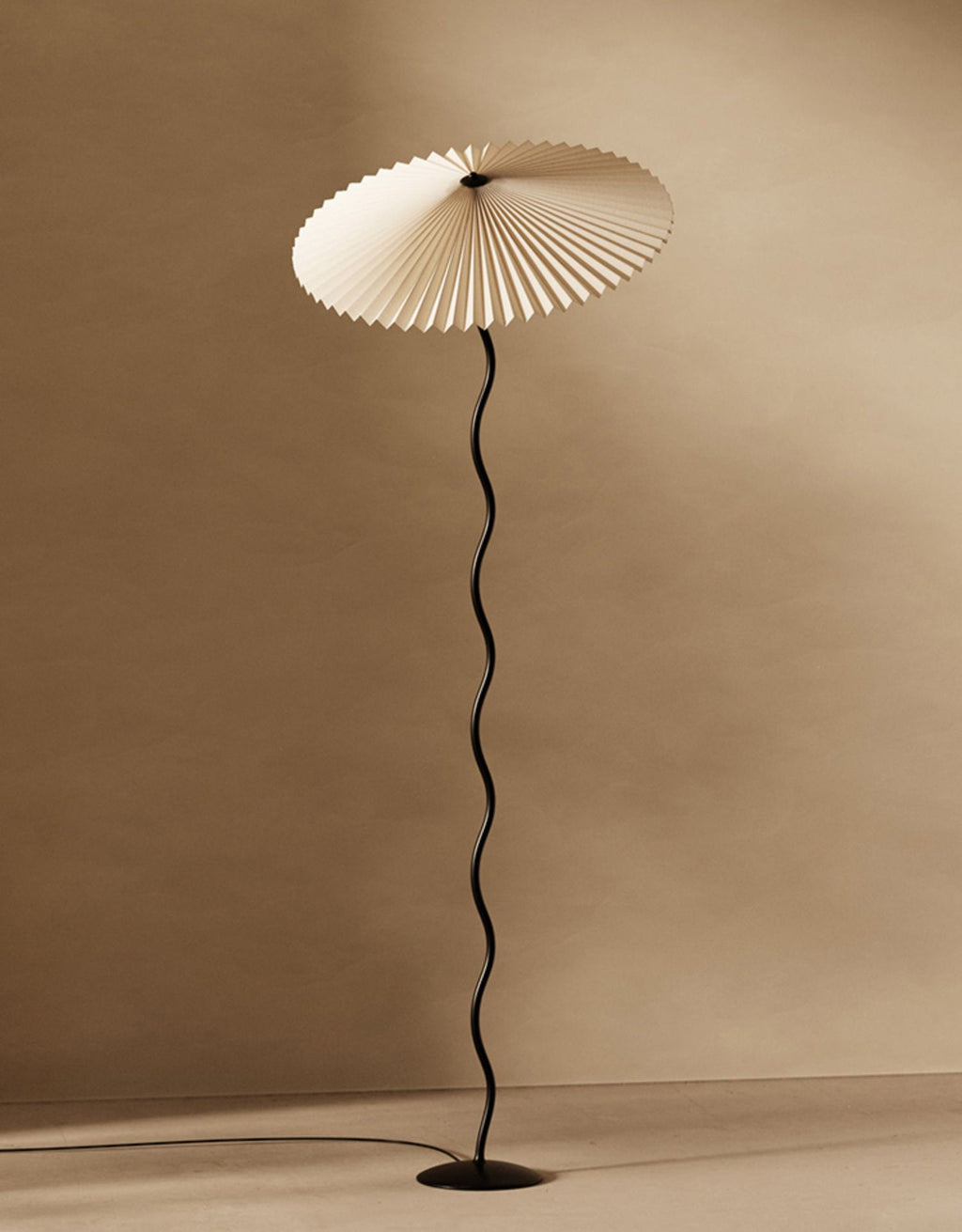 Squiggle floor lamp full view with sculptural black base