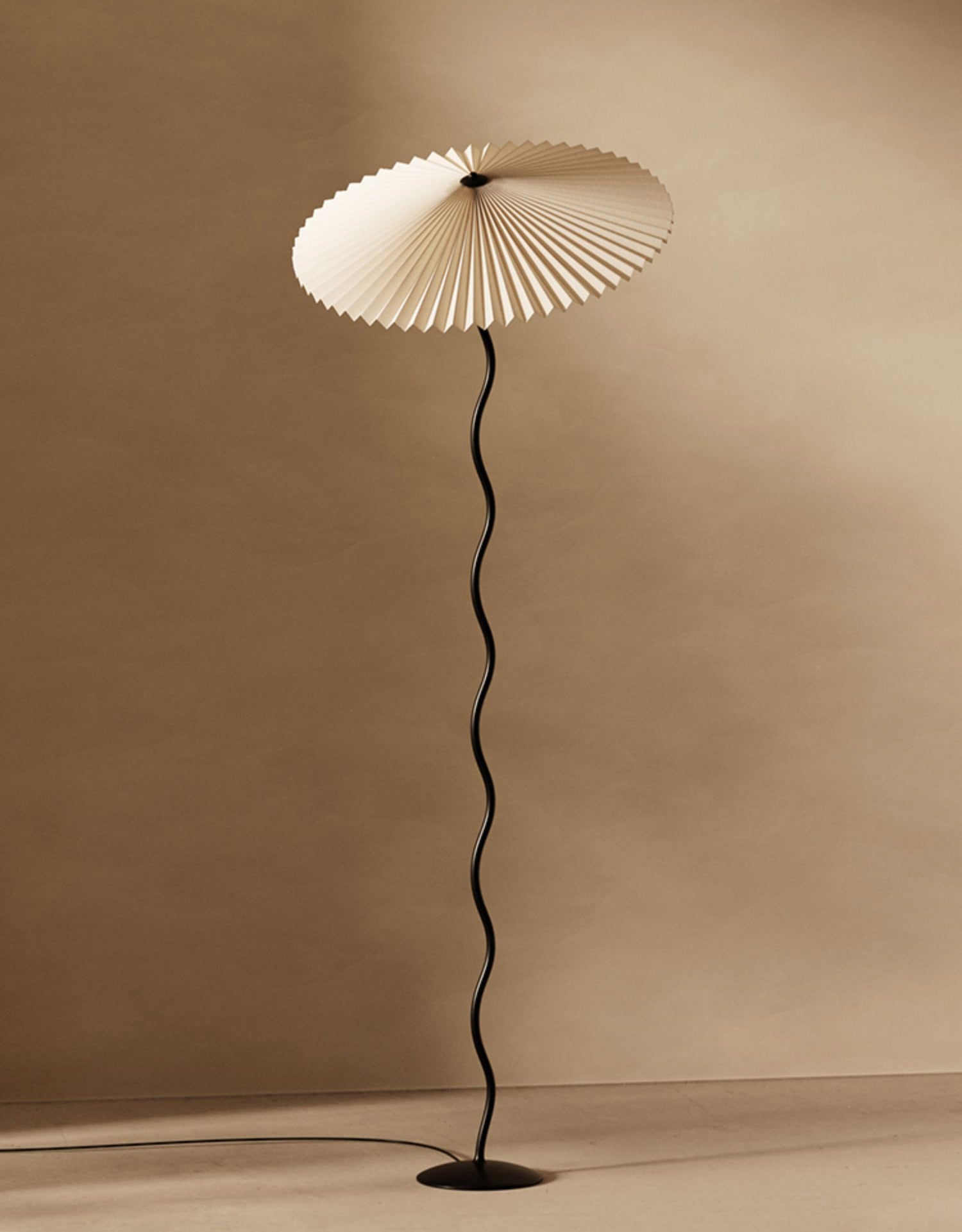 Squiggle floor lamp full view with sculptural black base