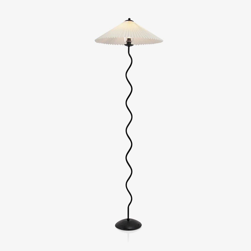 Squiggle floor lamp with fabric shade lit in a living space