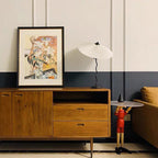 Squiggle table lamp with pleated fabric shade on a tabletop