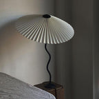 Squiggle table lamp detail of stem curve and shade base