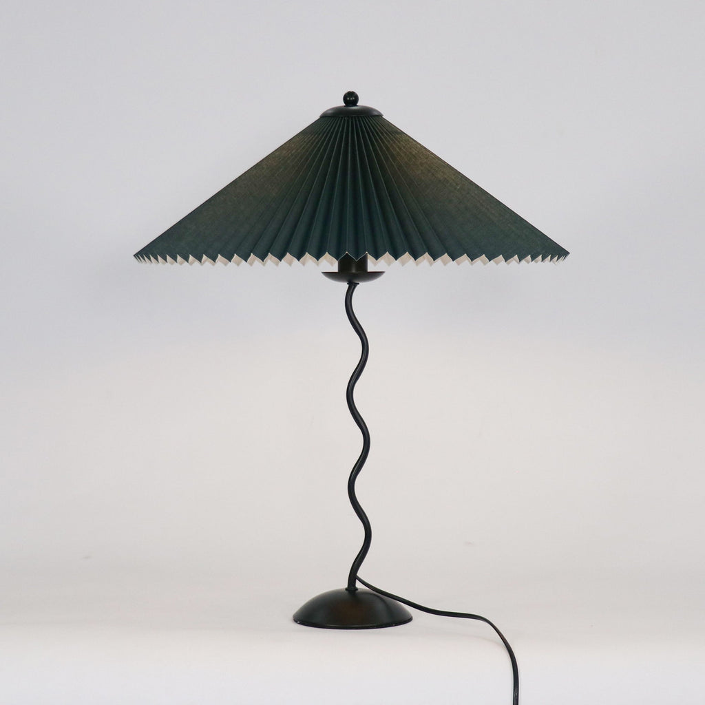 Squiggle table lamp showing the curvy sculptural stem